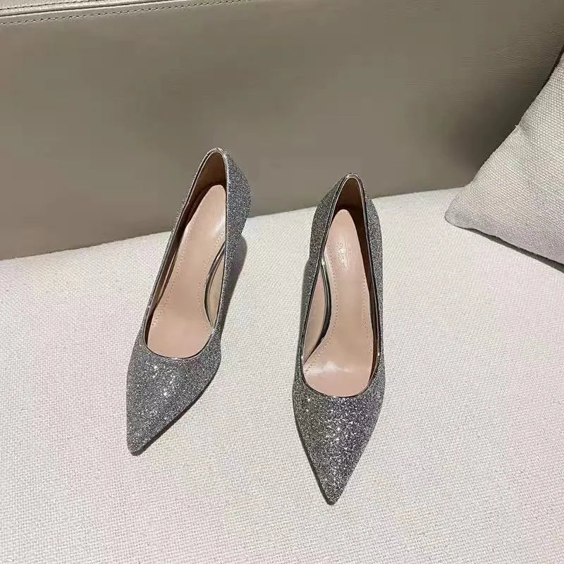 Women's silver and black bridal stiletto shoes with PU leather construction on a white background.