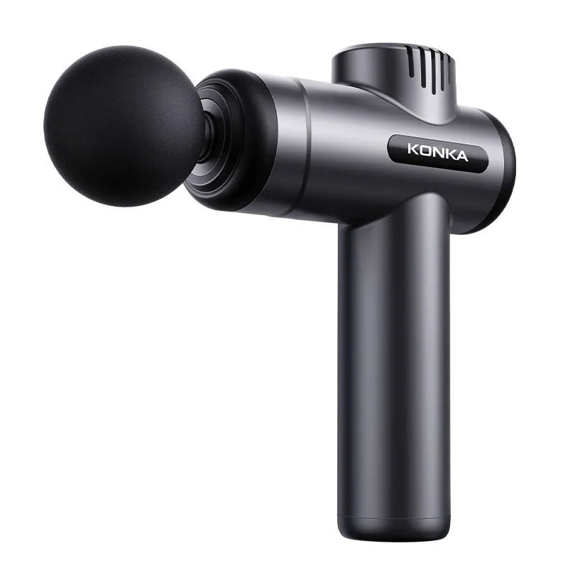 Konka V19 grey professional electric massage gun with multiple silicone attachment heads on a table.