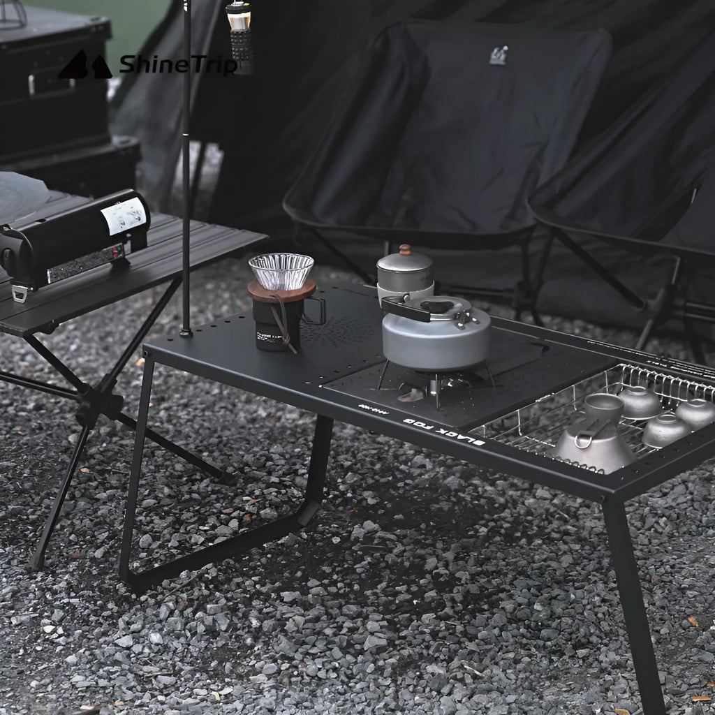Folding carbon steel camping table with IGT modular system and multiple cell board design options.