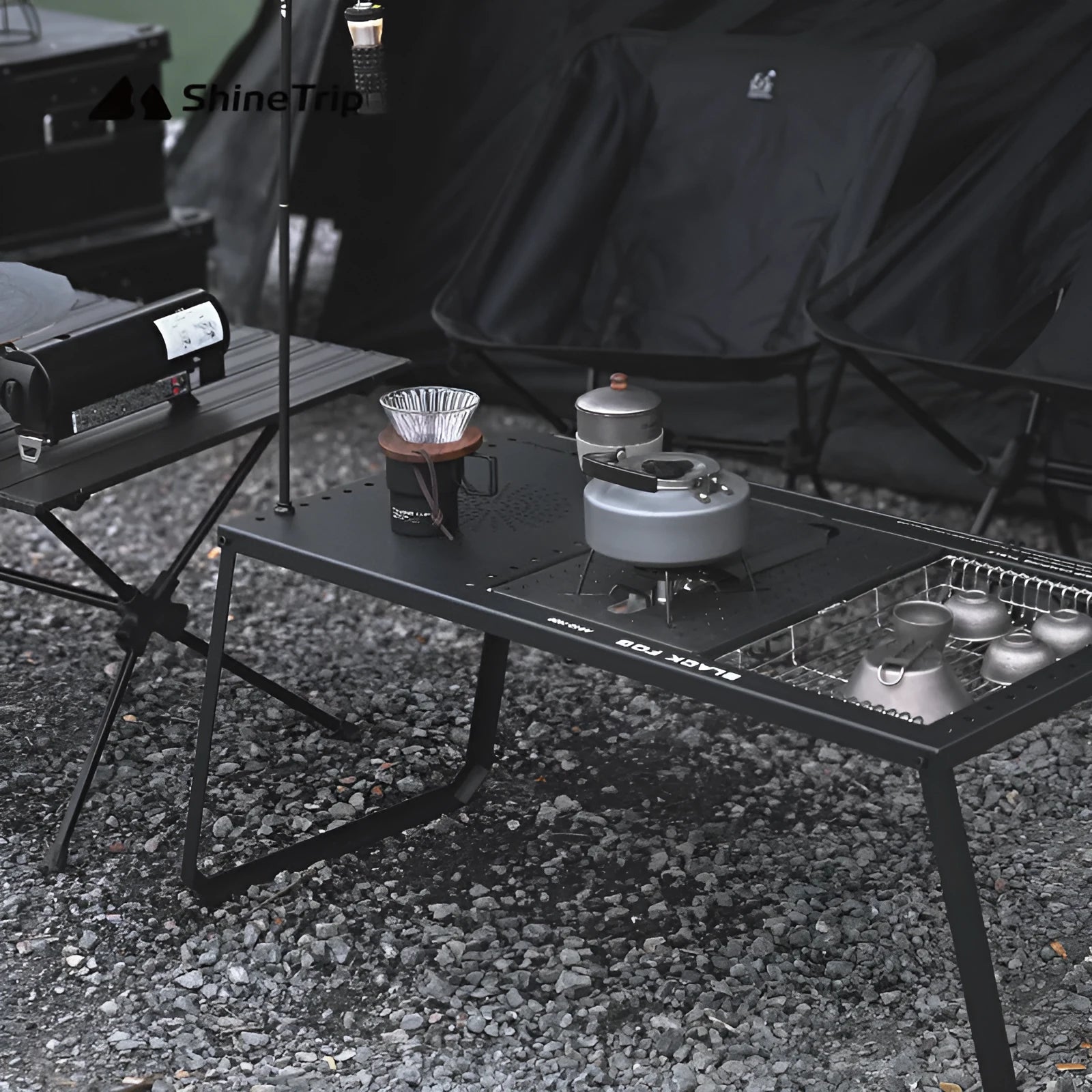 Folding carbon steel camping table with IGT modular system and multiple cell board design options.
