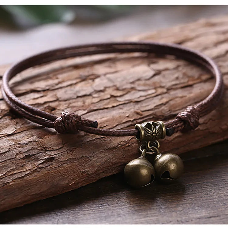Nylon rope dog collar with brass bell shown in black, red, and coffee colours.