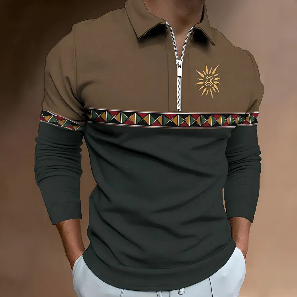 Man wearing a loose-fit, long-sleeve t-shirt with retro colour stripes and zipper decorations.