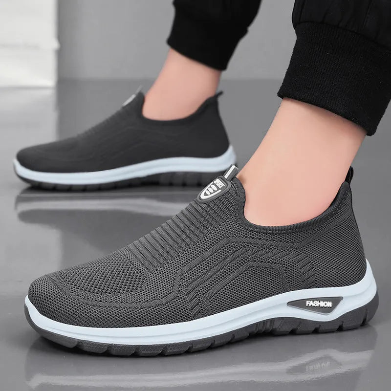 Men's black and grey breathable casual shoes with mesh lining, round toe, and PVC sole.