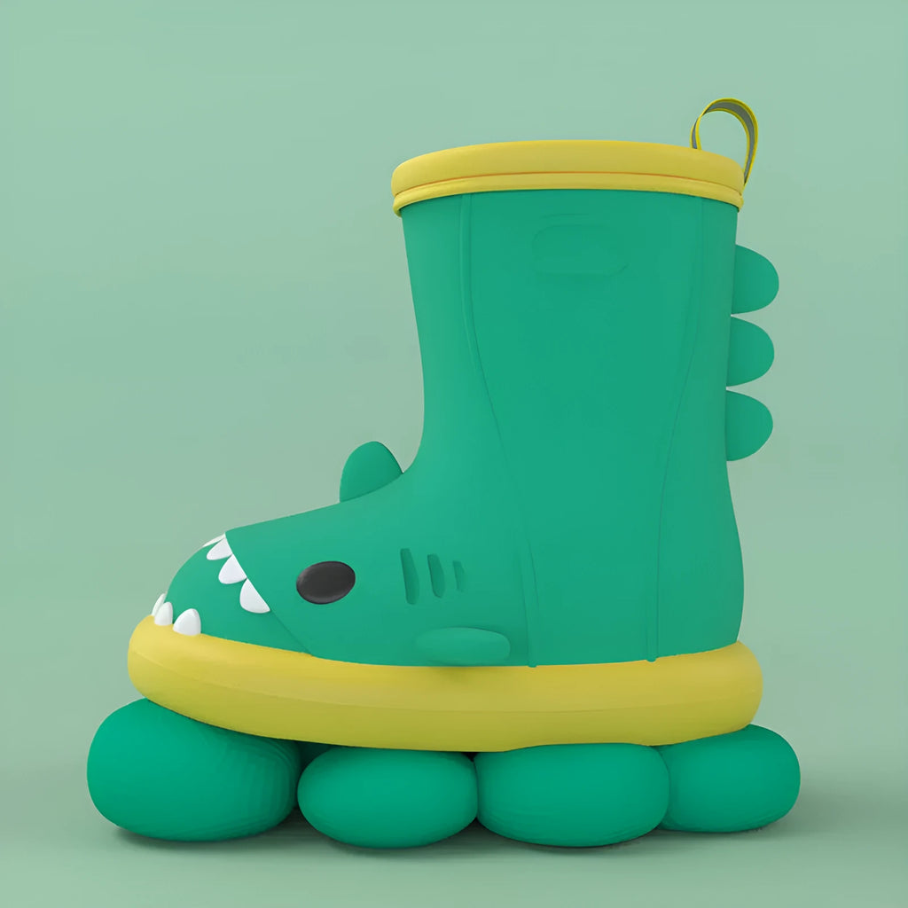 Shark brand children's green rain boots with a dinosaur graphic, showing medium height and plastic construction.