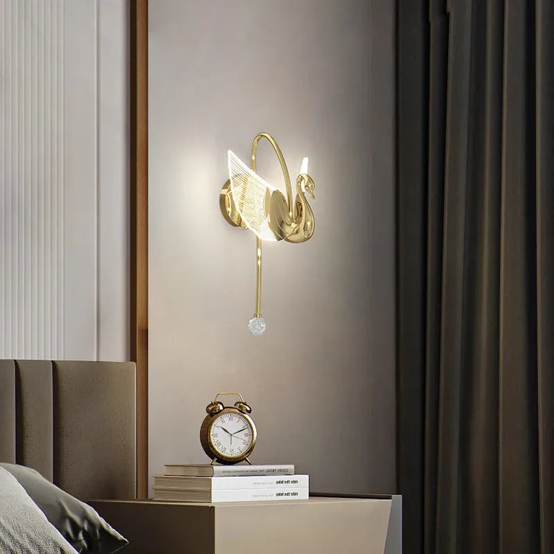 Modern gold swan-shaped wall lamp with acrylic shade and dimmable LED light.
