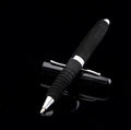 Silver EVA metal cap ballpoint pen with a 1.0mm tip on a notepad.