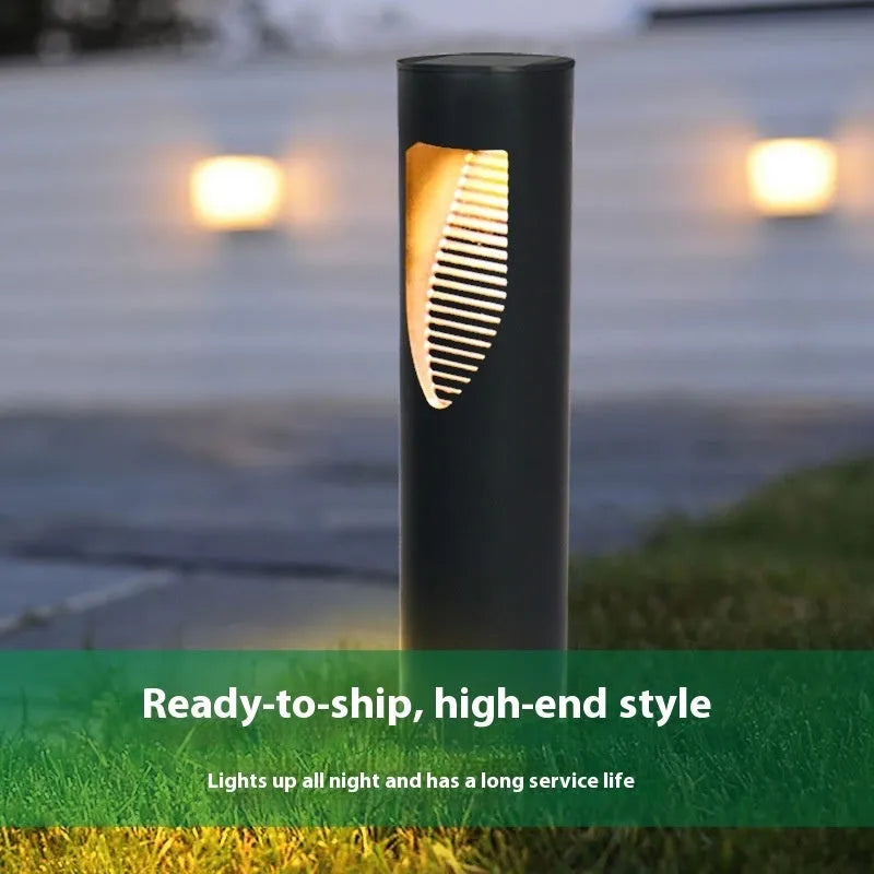 Black geometric solar-powered outdoor garden light with abstract design.