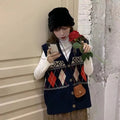 Sleeveless loose cardigan top in diamond plaid pattern, shown in khaki colour.