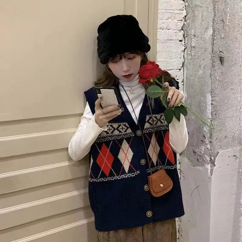 Sleeveless loose cardigan top in diamond plaid pattern, shown in khaki colour.