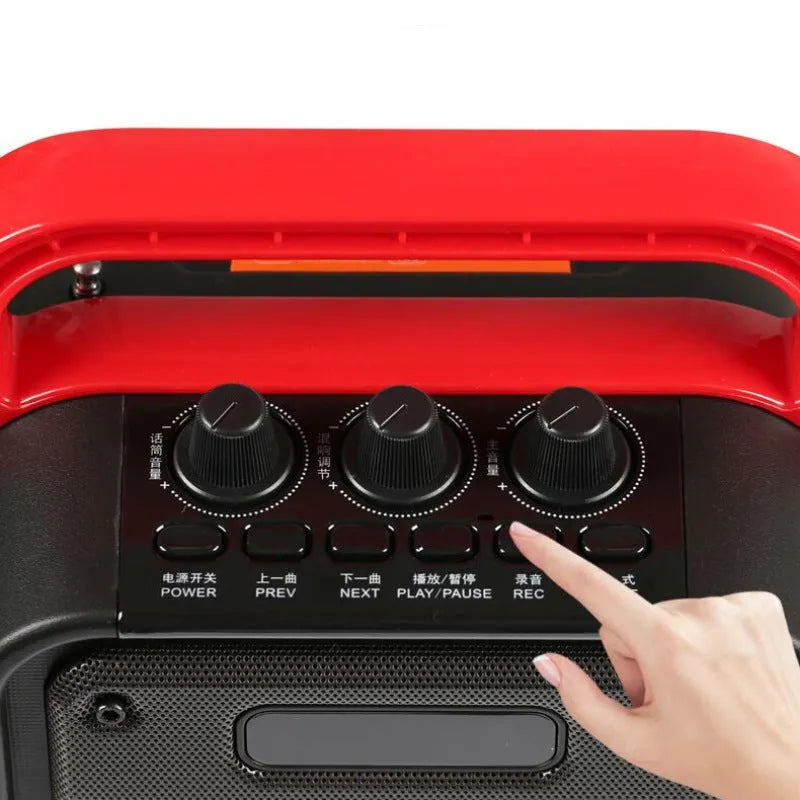 MS62AI portable Bluetooth karaoke speaker with wireless microphone and remote control on table.