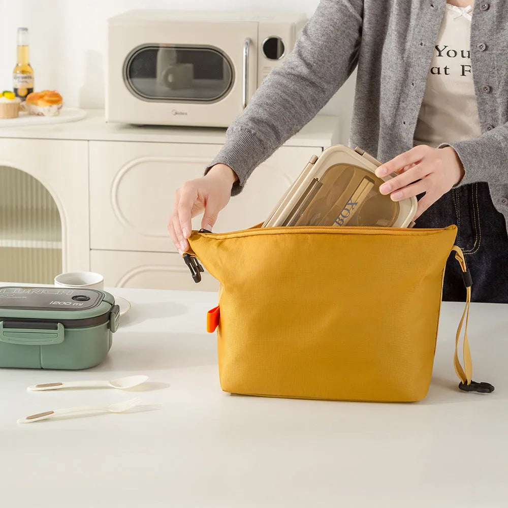 Japanese style insulated bag in army green Oxford cloth showing wide opening.