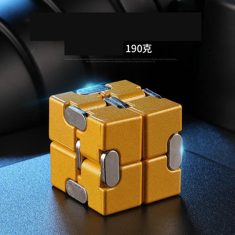 Black zinc alloy infinity cube fidget toy showing rotated cubes, on a white background.