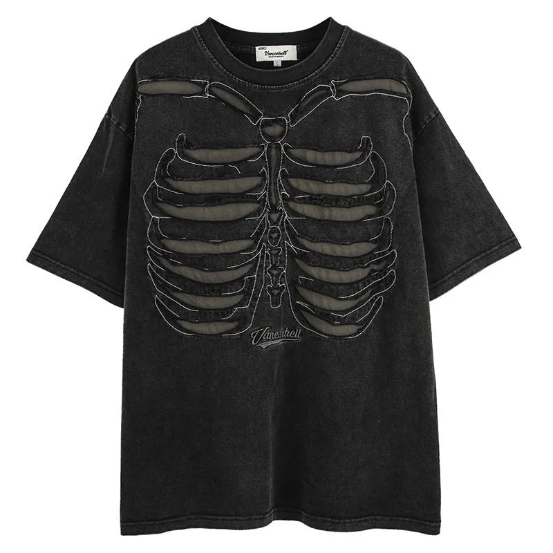 Man wearing a black loose-fit cotton pullover with a skull and letter graphic print and drop-shoulder sleeves.