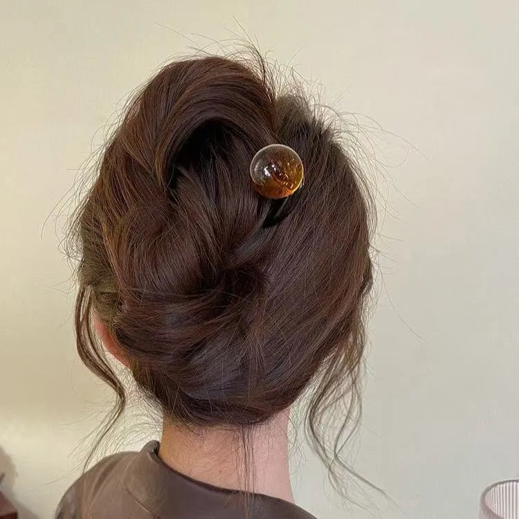 Acrylic U-shaped hair pin barrettes with retro ball decoration in beige, caramel, dark gray, and green colours.