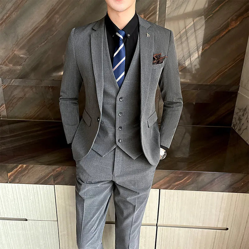 Men's slim fit British style business suit in black cotton blend fabric with adhesive interlining construction