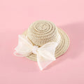 Pet cat wearing straw hat with pearl bow decoration in princess style costume accessory