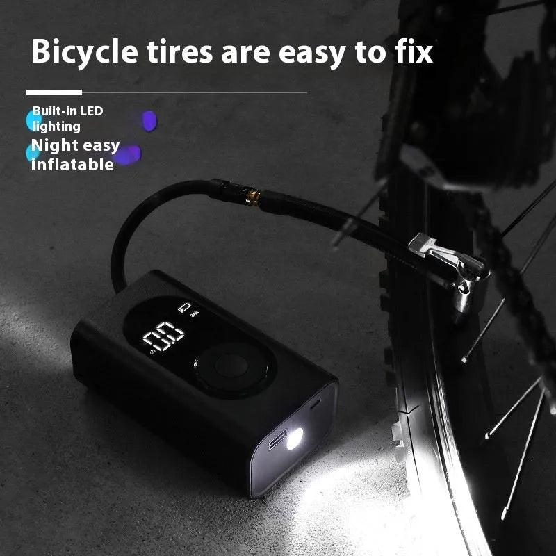 Portable handheld mini wireless tyre pump with power bank and flashlight on a grey background.
