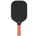 Black and orange 3K carbon fibre graphite honeycomb beach tennis racket on a 40cm scale.