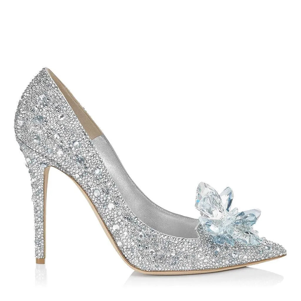 Women's gold high heels with pointed toe, rhinestone decoration, and a stiletto heel.