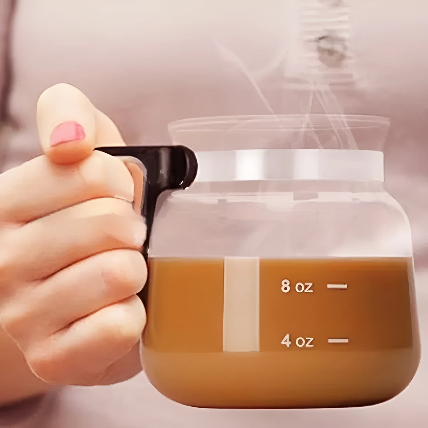 Transparent borosilicate glass coffee maker with silicone cover showing 355 to 473ml capacity