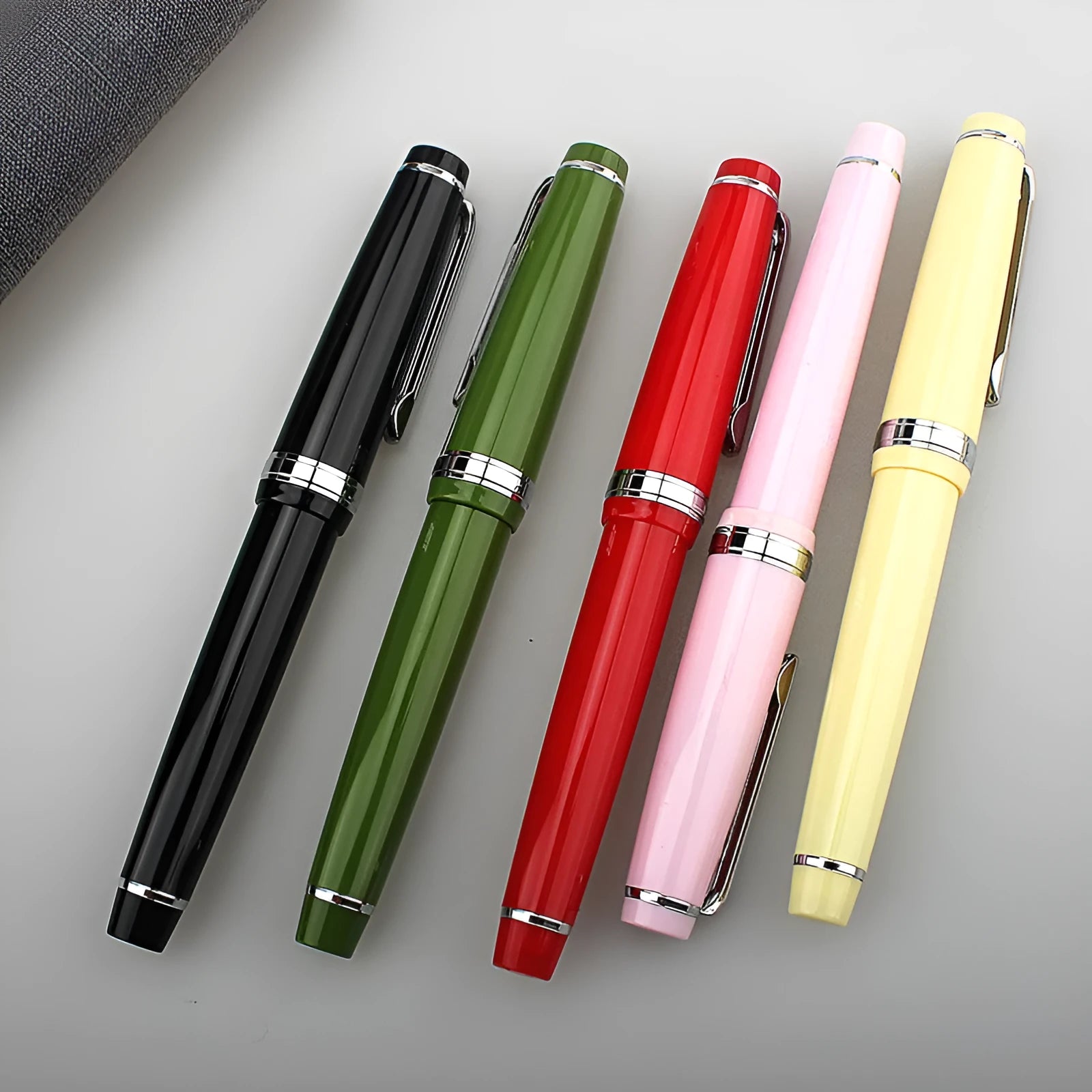 Short pocket fountain pen with resin barrel and stainless steel nib in various colour options.