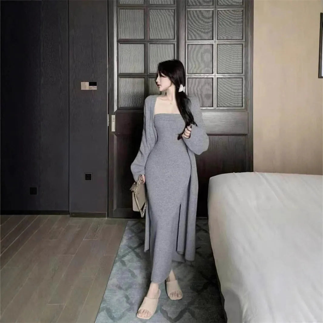 Woman wearing a grey textured flecked long-sleeve dress with a matching open cardigan from a two-piece knit set.