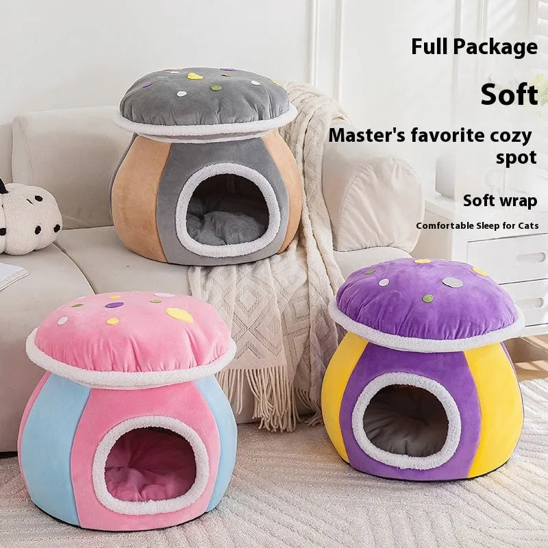 Grey mushroom-shaped enclosed cat bed with plush interior and a detached matching blanket on a wooden floor.
