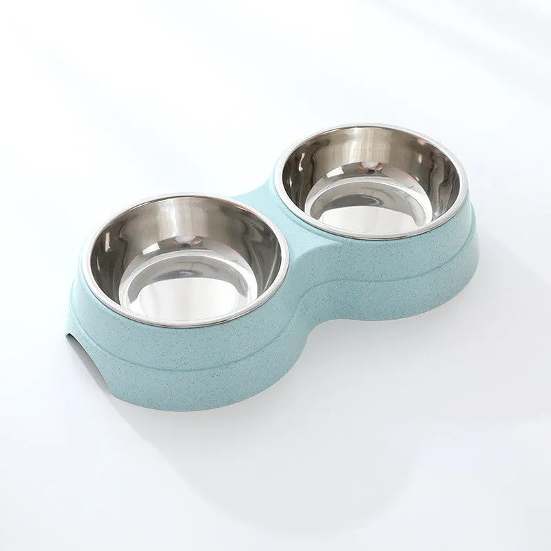 Double pet bowl set with two stainless steel bowls and blue straw holder on white background