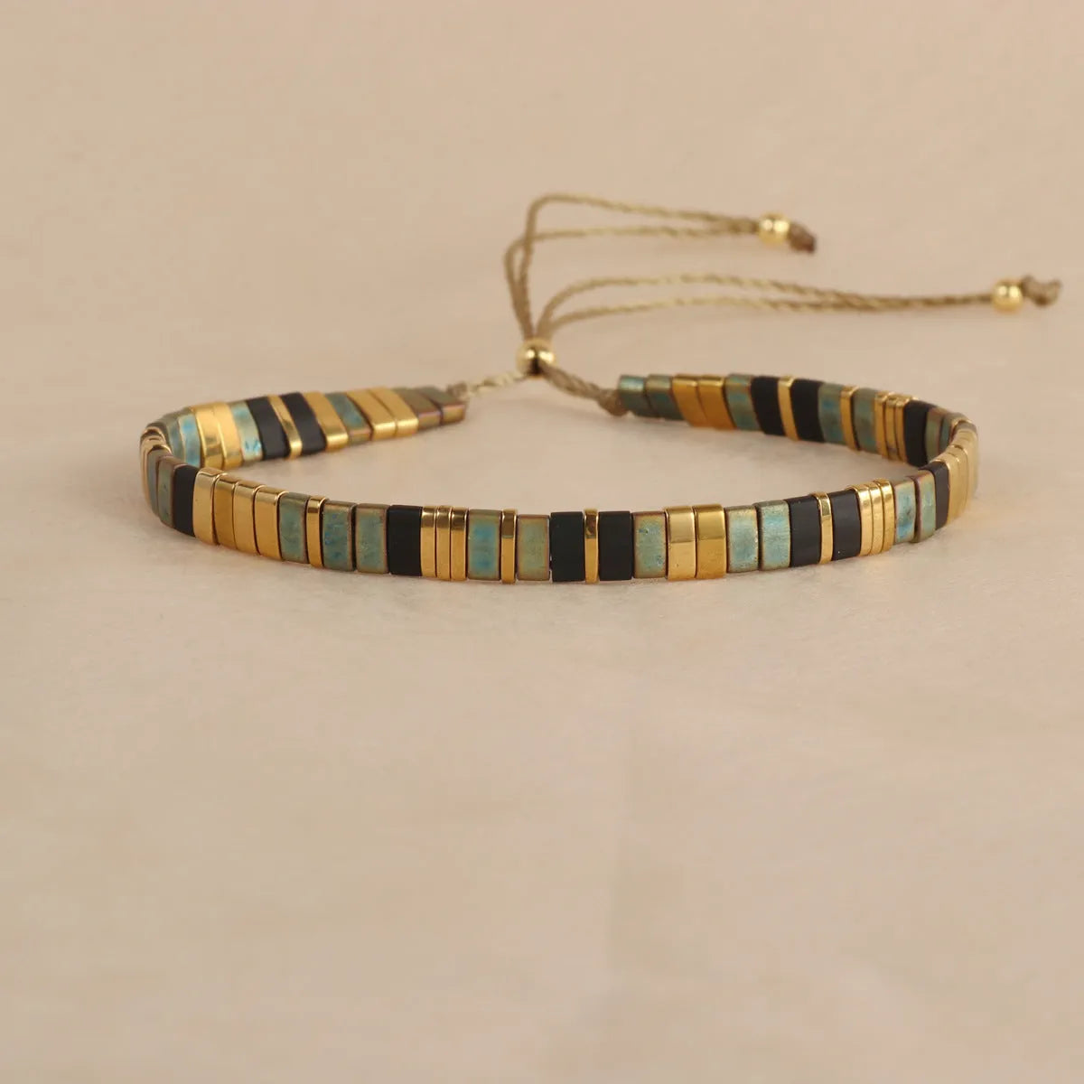Geometric beaded bracelet with round glass and coloured glaze beads in five colour options.