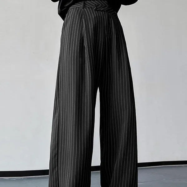 Men's black vertical striped pleated casual trousers showing elastic fabric and Asian sizing options