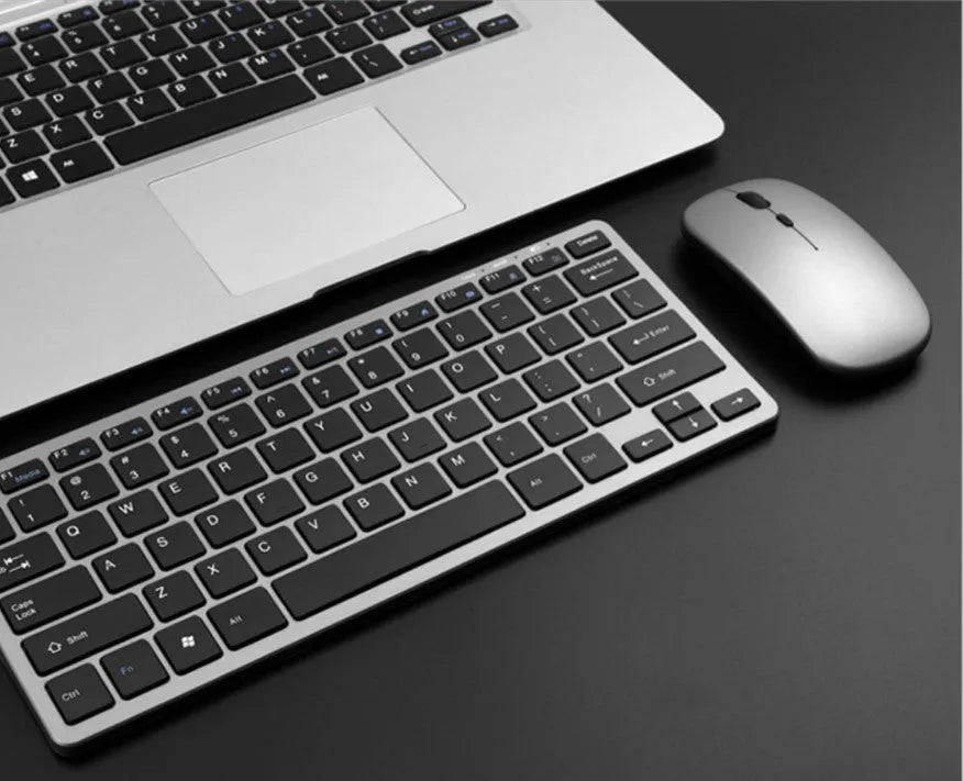 Wireless Bluetooth keyboard and mouse set in silver white with 78 keys and USB charging ports