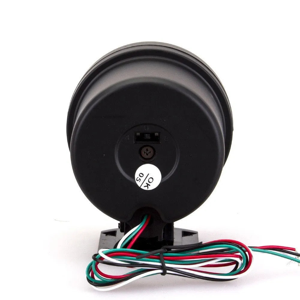 Black automotive tachometer with blue light pointer dial for measuring engine RPM.
