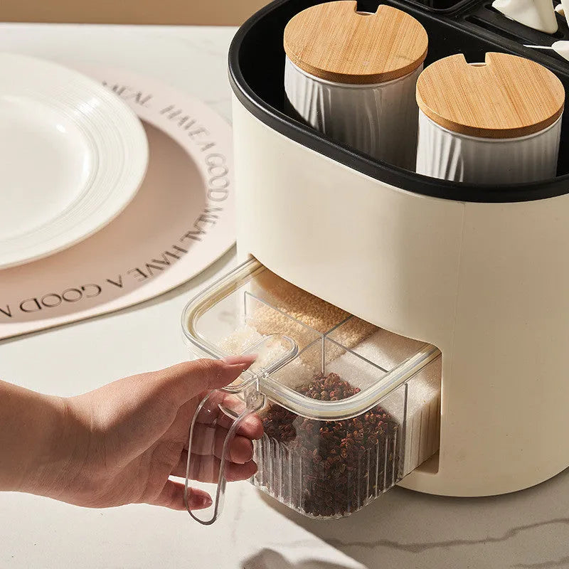 Rotating kitchen storage container with spice box organises utensils and seasonings