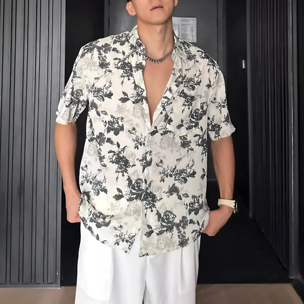 Loose fit short sleeve floral print shirt in white, shown on a hanger.