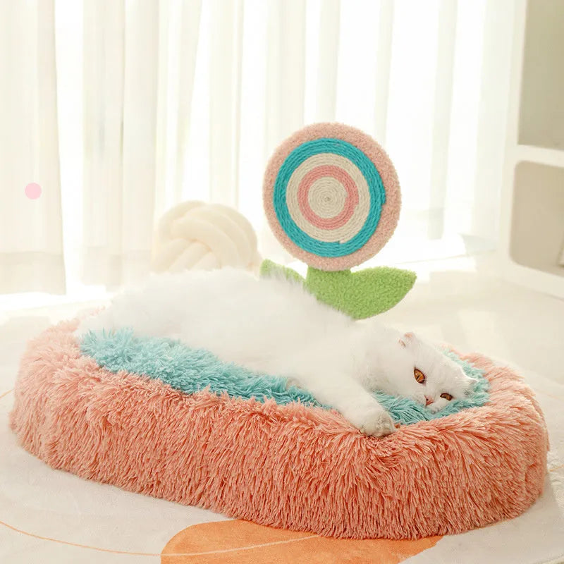 Pink elliptical lollipop-shaped plush cat bed with a removable cover.