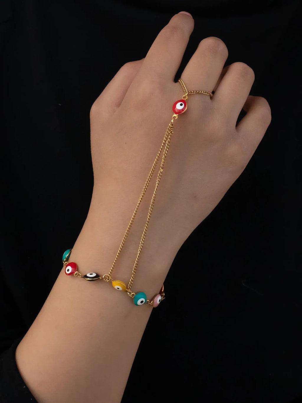 Women's titanium steel round eyes lucky mitten-type bracelet in colourful electroplated finish on a neutral background