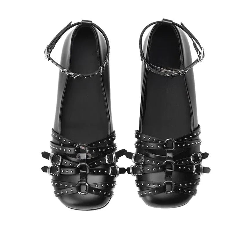 Black women's patent leather buckle pumps with a square toe and flat rubber sole.