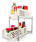 White plastic two-tier desktop storage rack on a bathroom counter holding toiletries, 41.5cm wide