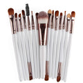 Open MAANGE 18-piece makeup set showing brushes, fan tools, eyeshadow palettes in a flat case.