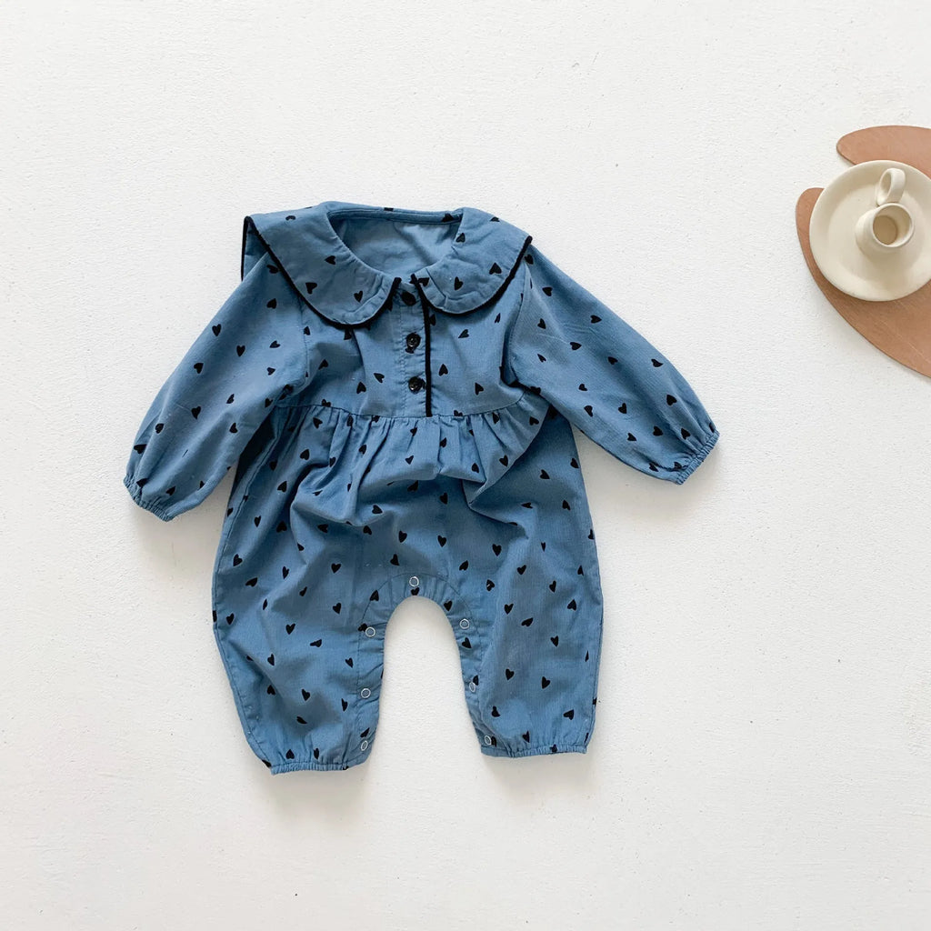 Baby onesie autumn corduroy long sleeve neutral gender beige infant bodysuit on white background