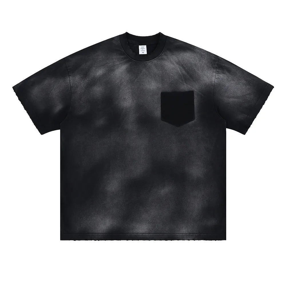 Black loose-fit men's cotton t-shirt with drop-shoulder sleeves on a grey background.