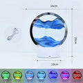 Creative 3D quicksand table lamp with glass shade and USB cable, showing touch control and coloured light options.
