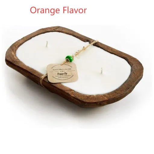 Lavender-scented soy wax candle in a wooden basin with a wooden wick