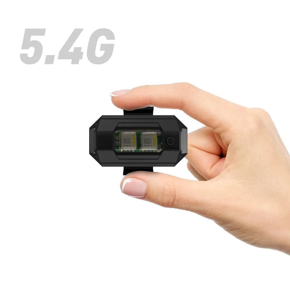 Drone strobe signal light with RGB LEDs next to Type-C charging cable and roll of mounting tape.