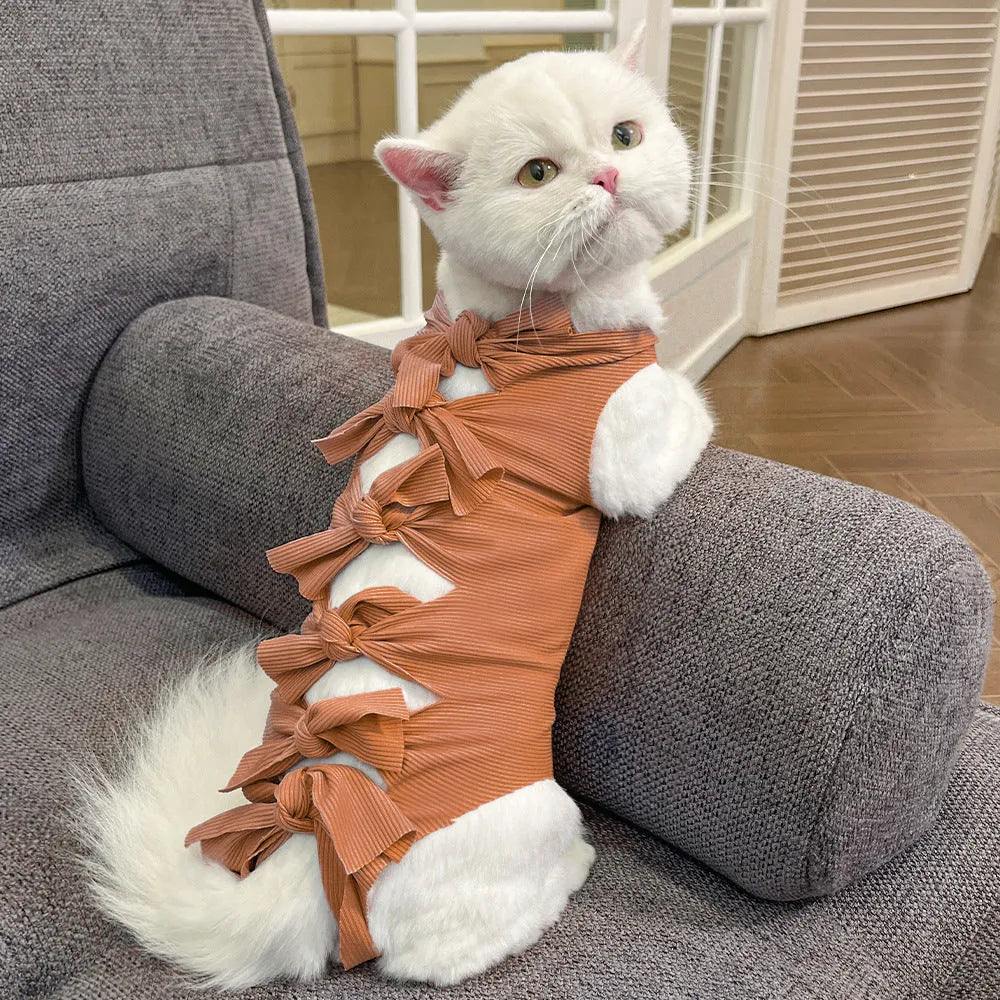 Lace-up cat recovery suit in blue, shown on a cat, featuring a full-body wrap design and adjustable back lacing.