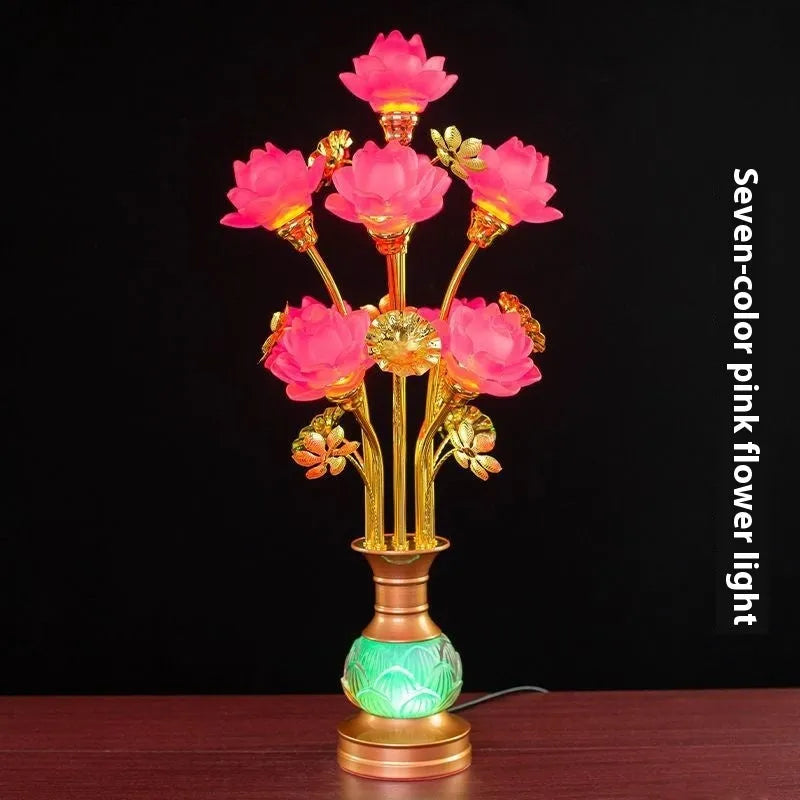 Coloured glaze pink and yellow LED lotus lantern for Buddha worship on an alloy stand.