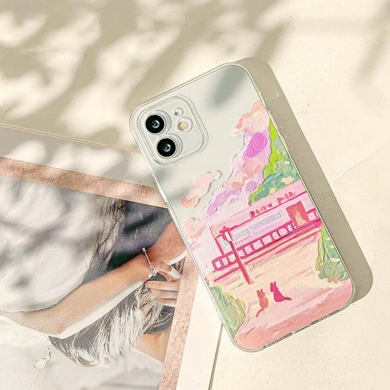 Soft silicone iPhone case with a colourful two cat cartoon design on the back