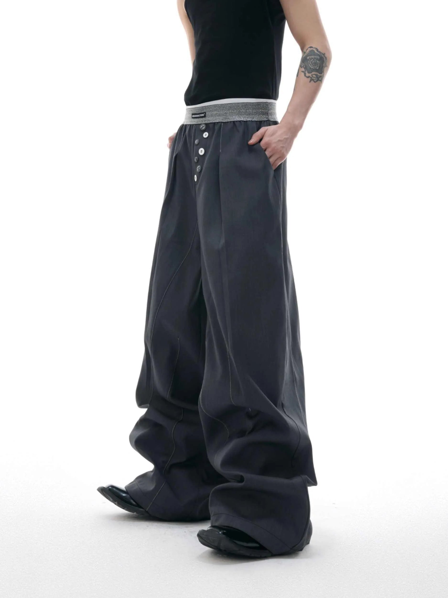 Straight-leg trousers with button-open seam design in black or grey polyester-cotton blend
