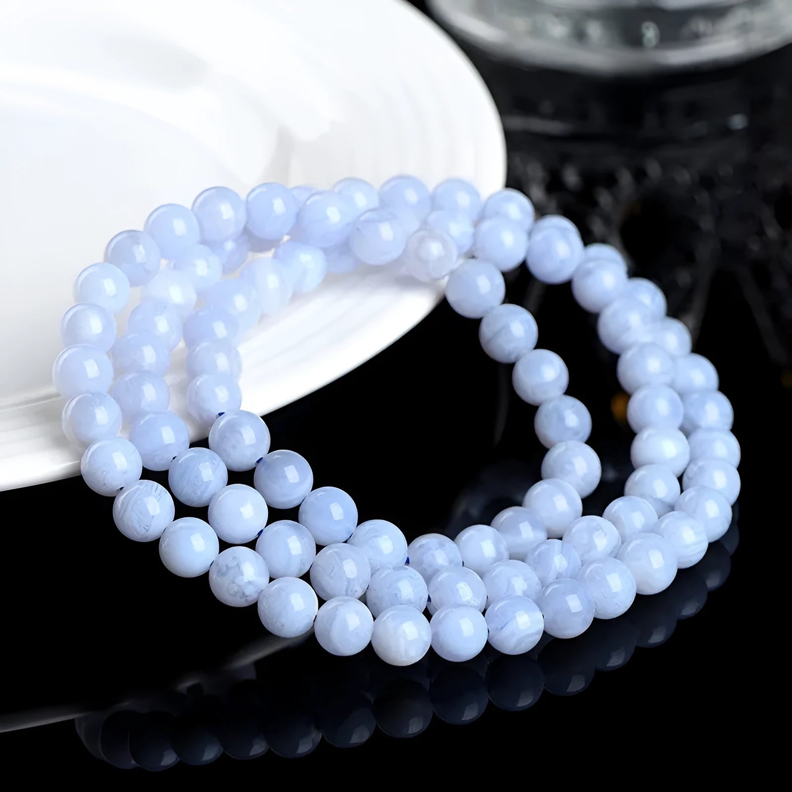 Original blue agate bracelet with multi-circle patterned beads and Ruyi design elements.