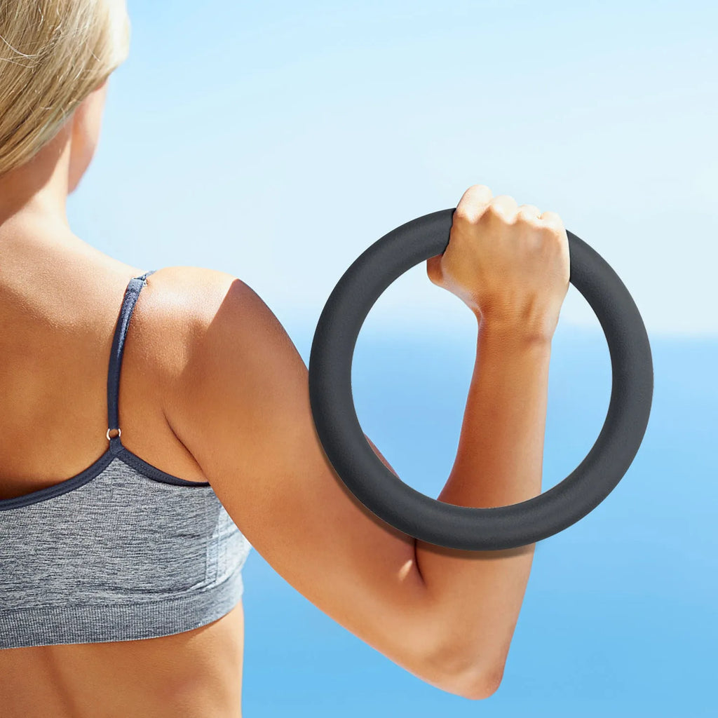 Black silicone coated iron exercise hoop 32cm diameter 4.5kg on indoor floor